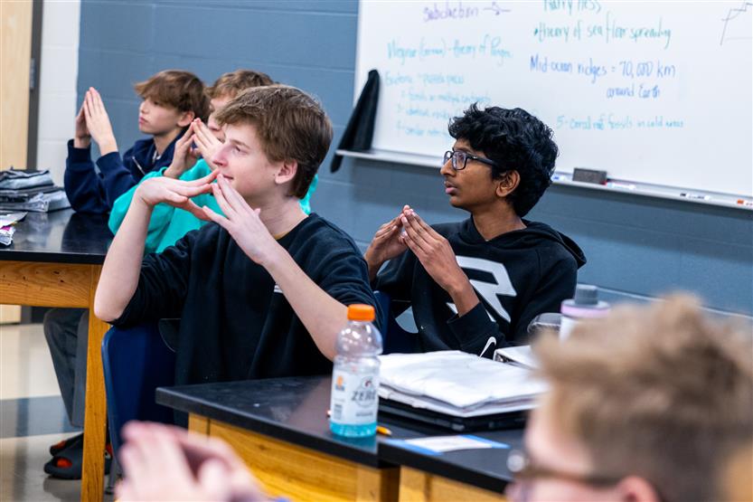 Students do a science experiment